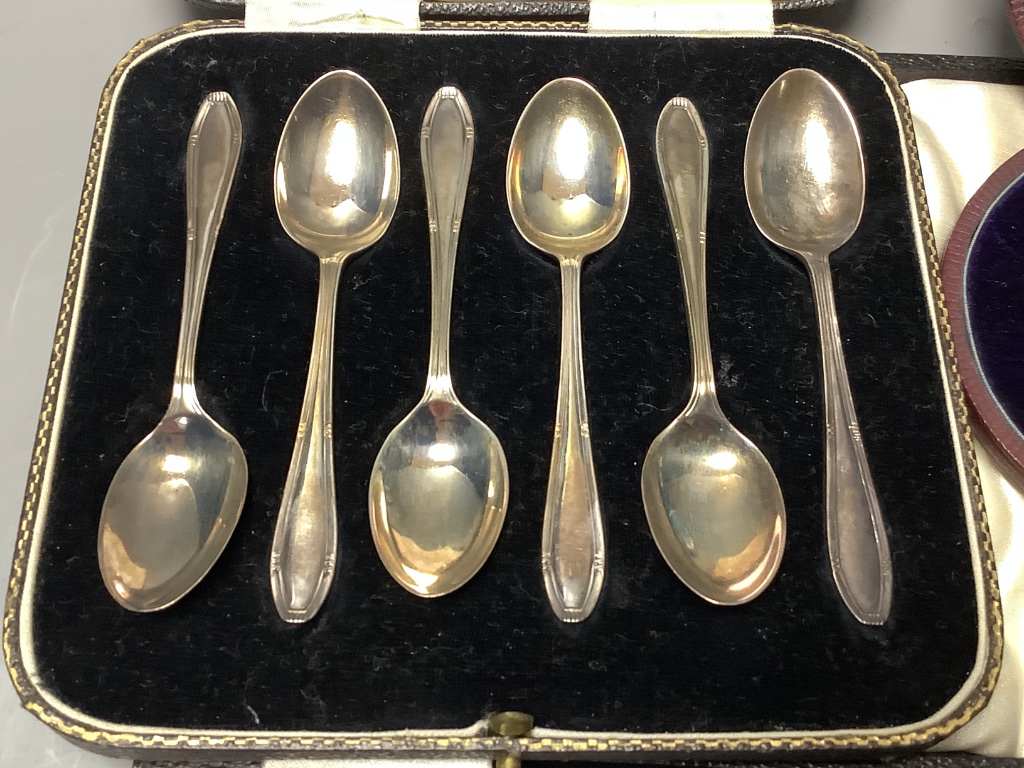 A cased Victorian silver christening trio, Martin, Hall & Co, Sheffield & London, 1879 and two other cased sets of silver teaspoons (6 & 12).